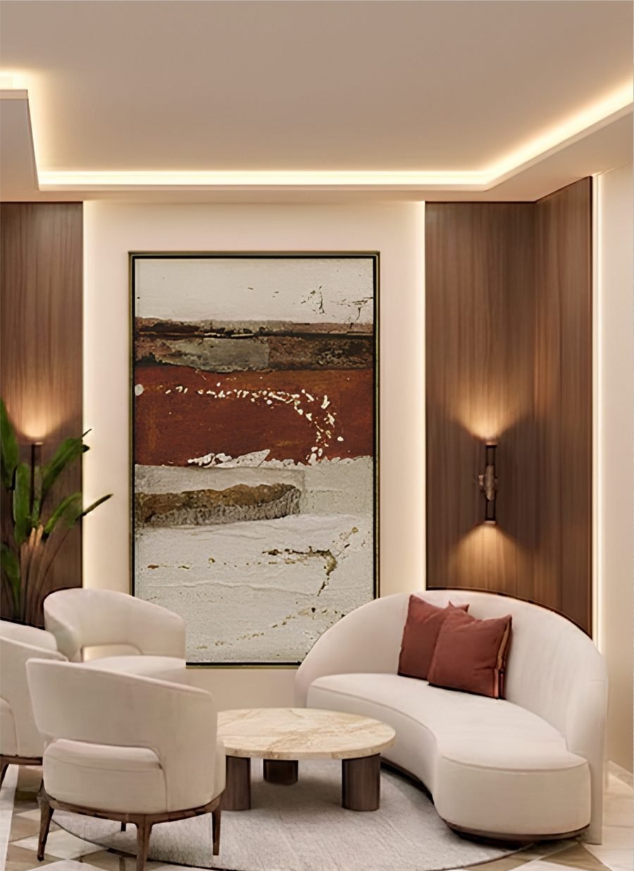 Residents' lounge with curved seating and marble flooring at The Privé