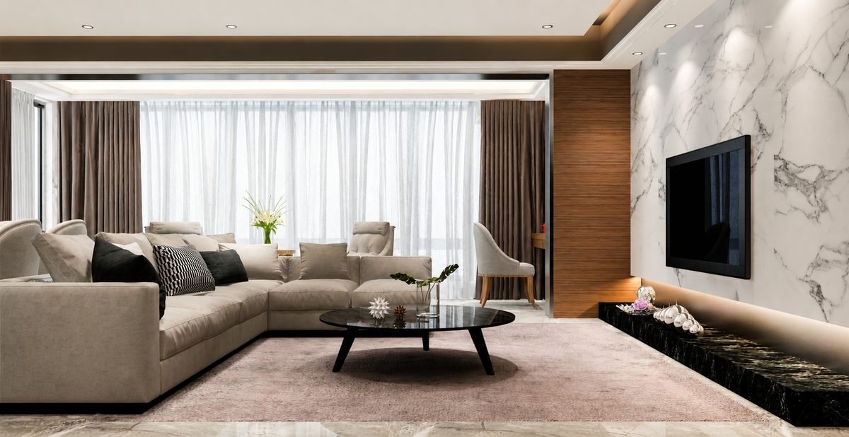 Living room at The Privé with full-height DGU glazing and sheer drapery